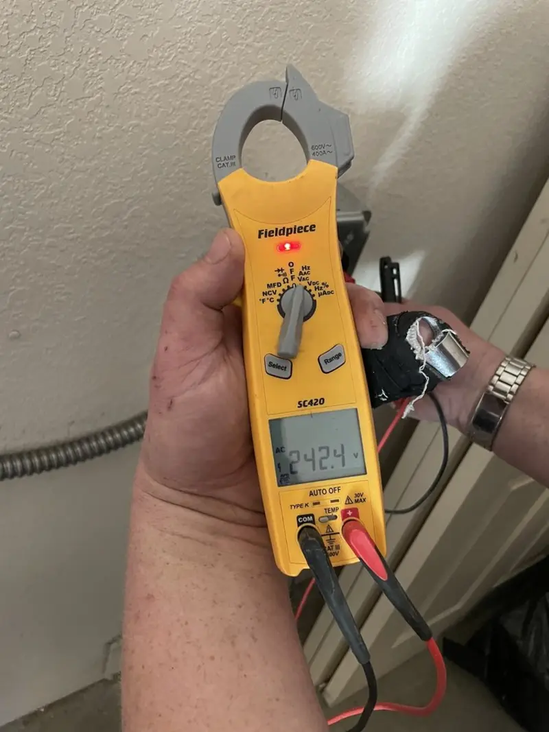 Voltage testing with clamp meter during Ceiling Fan Installation in Leesylvania